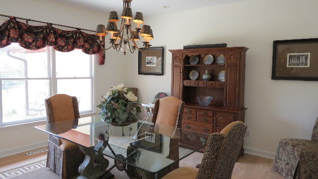 1143 Klopfer Road Macon, GA 31210 - Photo 4 of 19 a view of a dining room with furniture window and wooden floor