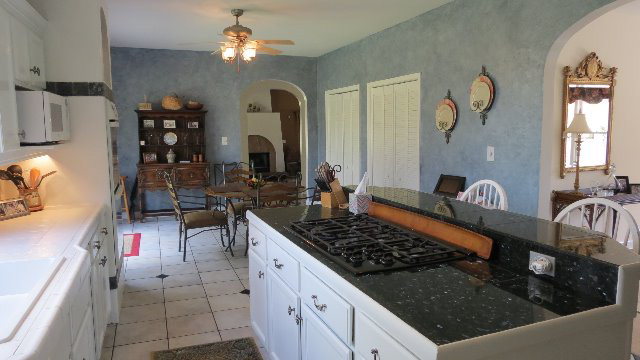 1143 Klopfer Road Macon, GA 31210 - Photo 6 of 19 a kitchen with stainless steel appliances granite countertop a sink stove and cabinets