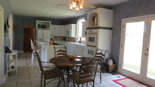 1143 Klopfer Road Macon, GA 31210 - Photo 7 of 19 a view of a dining room with furniture and chandelier