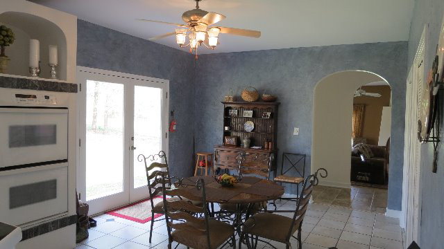 1143 Klopfer Road Macon, GA 31210 - Photo 8 of 19 a view of a dining room with furniture and chandelier