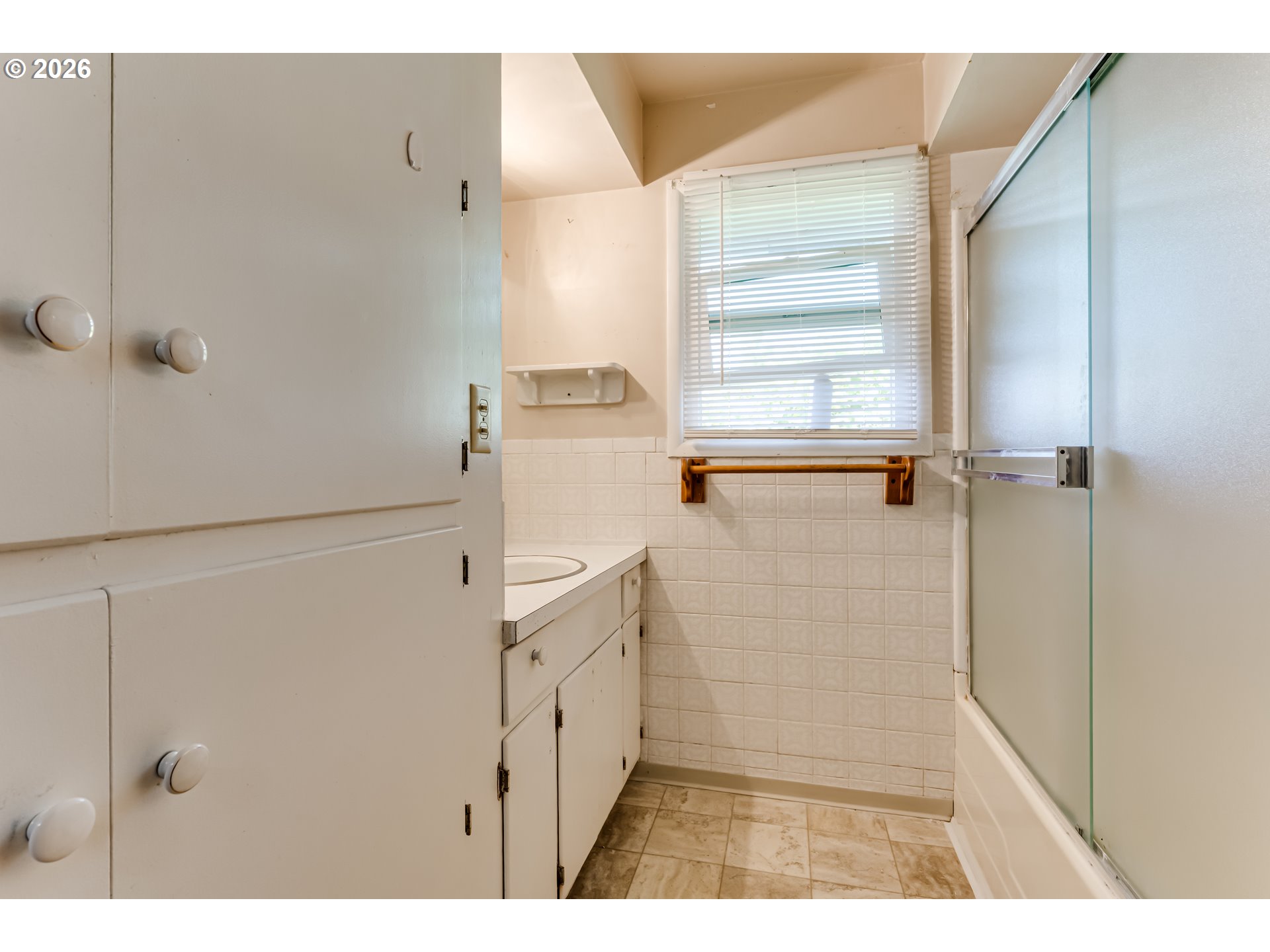 4076 North Street Springfield, OR 97478 - Photo 17 of 21 a bathroom with a shower and a sink