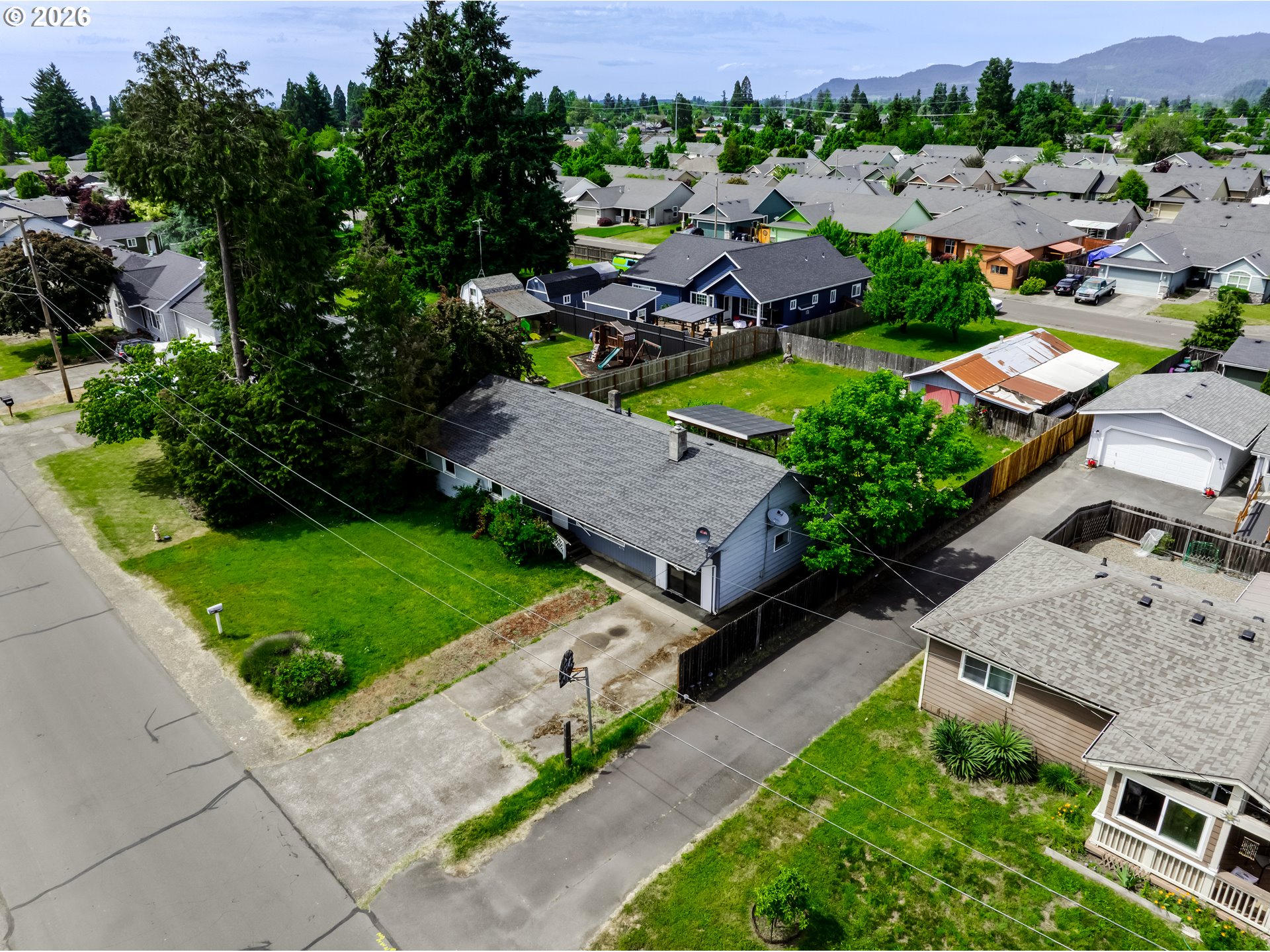 4076 North Street Springfield, OR 97478 - Photo 4 of 21 an aerial view of multiple houses with yard