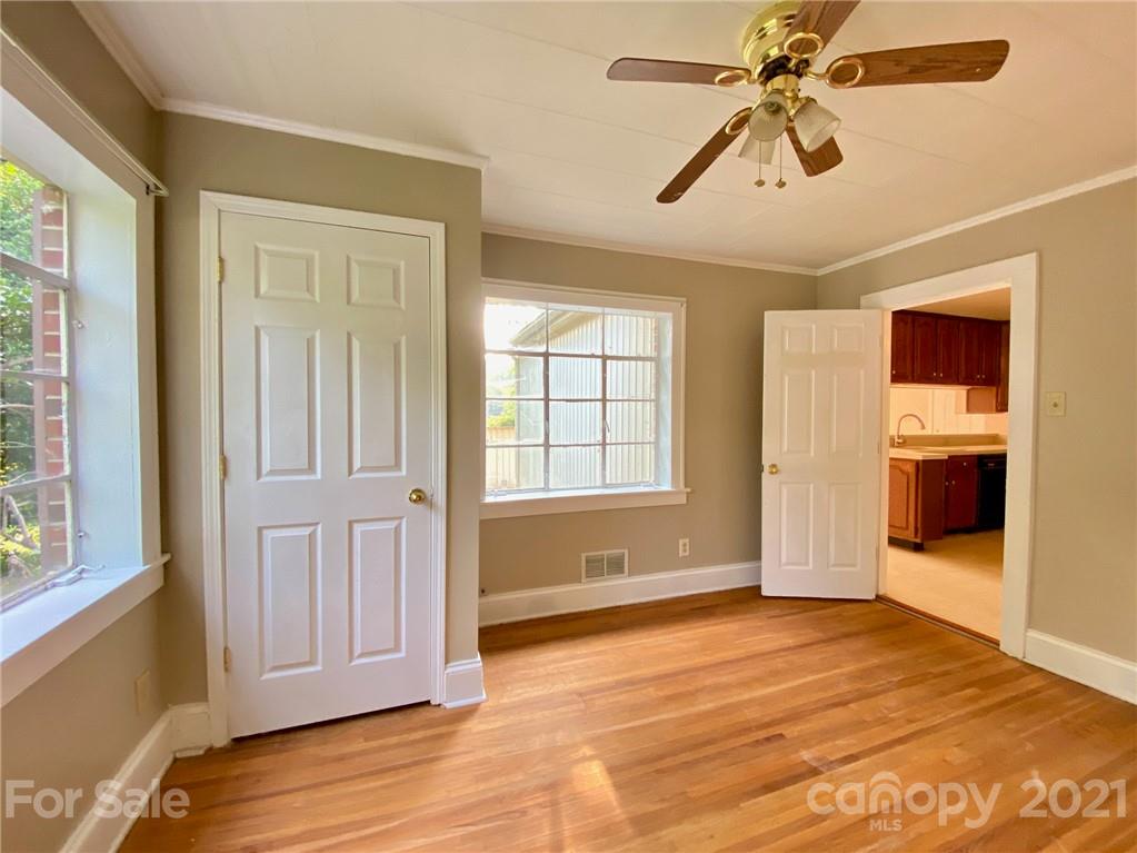 8930 Cool Springs Road Woodleaf, NC 27054 - Photo 21 of 42 a view of empty room with wooden floor and fan