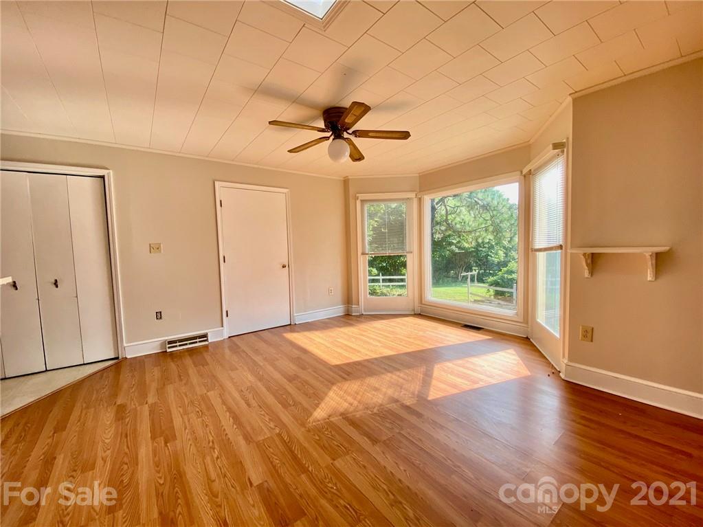 8930 Cool Springs Road Woodleaf, NC 27054 - Photo 26 of 42 a view of an empty room with a window