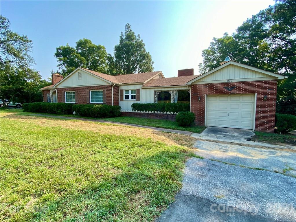8930 Cool Springs Road Woodleaf, NC 27054 - Photo 30 of 42 a view of a house with a yard and large tree