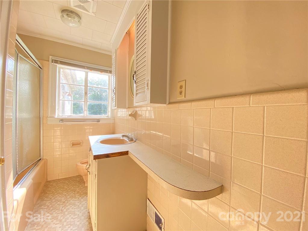 8930 Cool Springs Road Woodleaf, NC 27054 - Photo 8 of 42 a bathroom with a sink and a shower