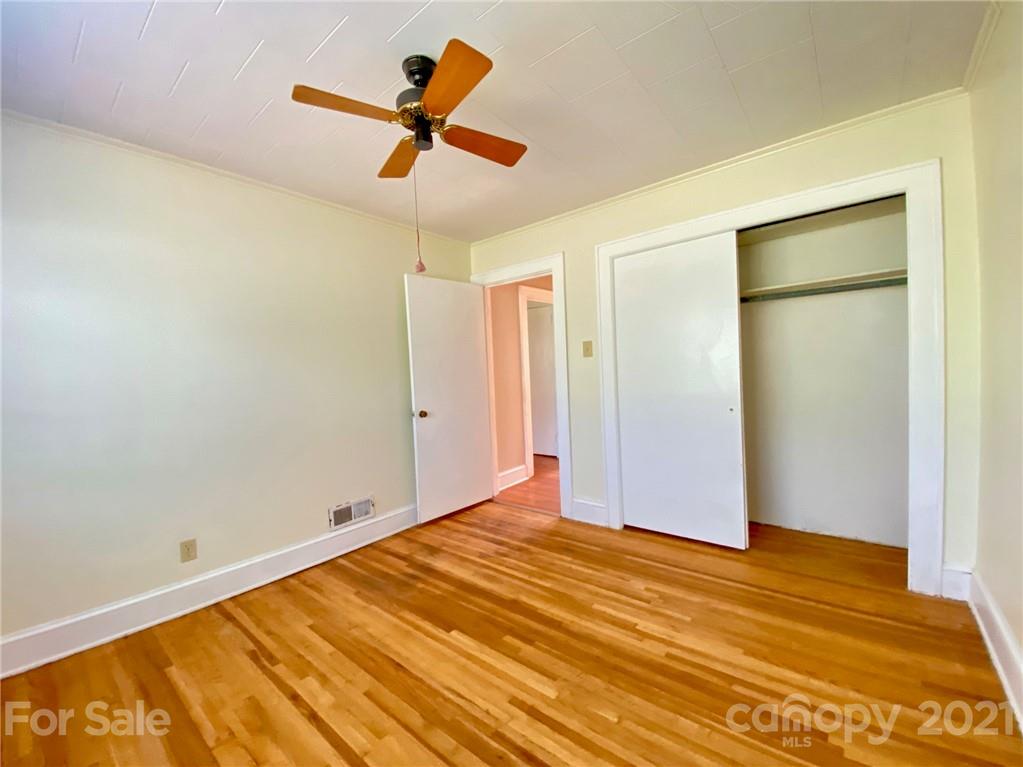 8930 Cool Springs Road Woodleaf, NC 27054 - Photo 10 of 42 a view of empty room with wooden floor