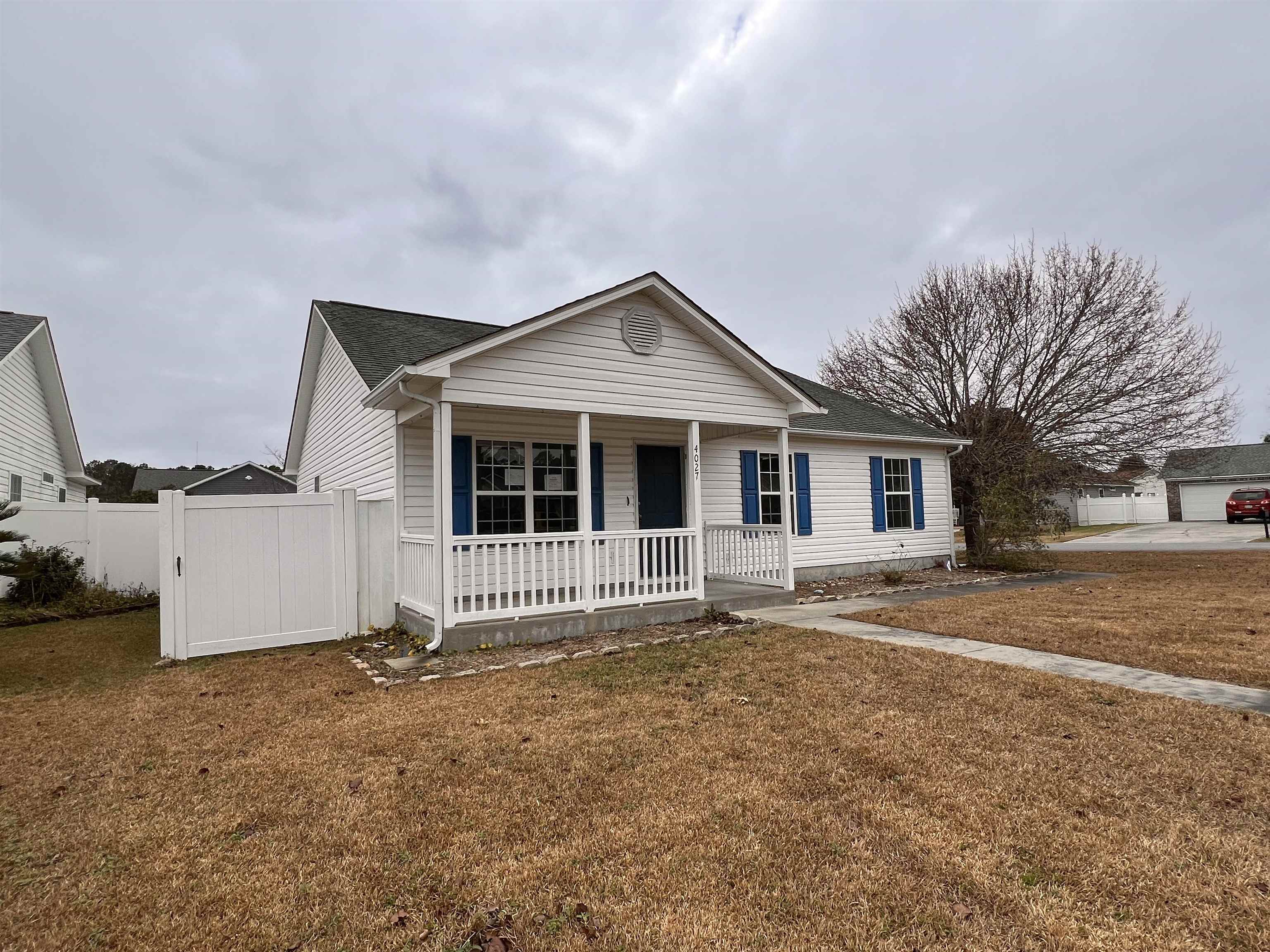 4027 Douglas Fir Lane Murrells Inlet, SC 29576 - Photo 20 of 22 Single story home featuring covered porch and roof with shingles