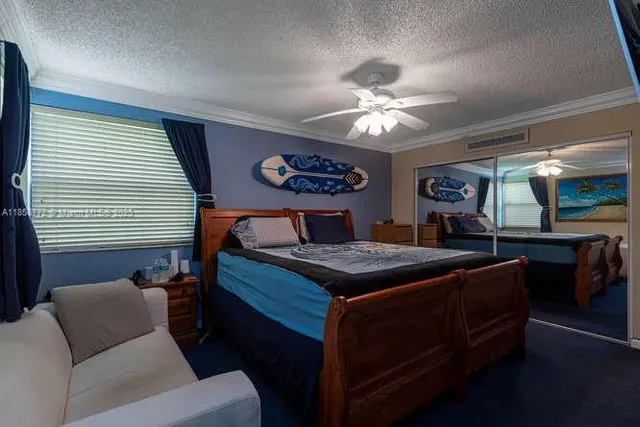 a bed room with a bed and a chandelier