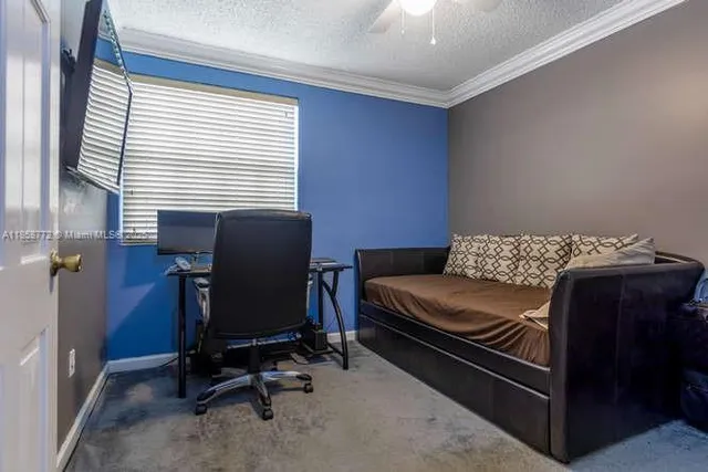 a view of workspace with furniture and a window