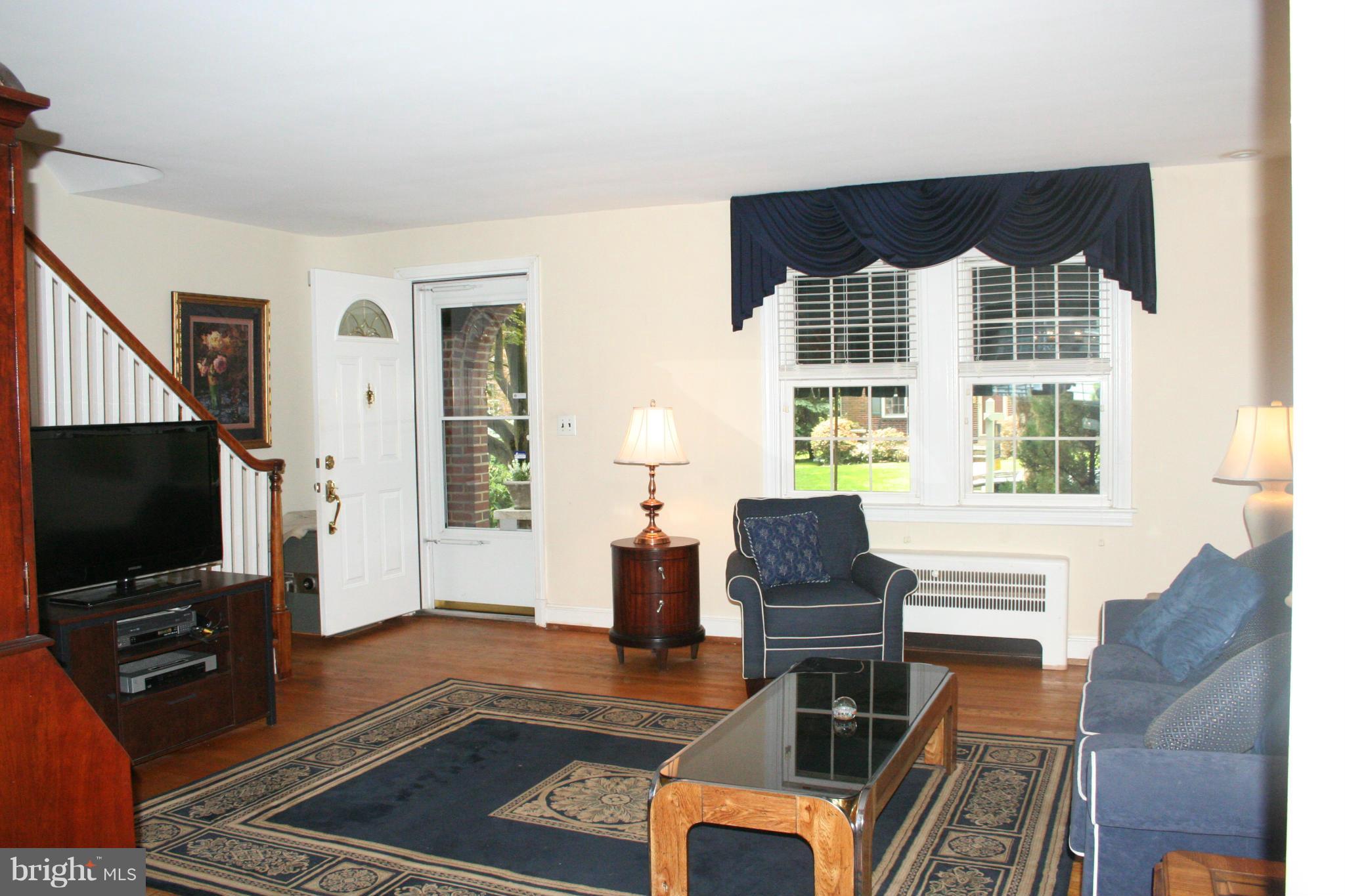 216 Dunkirk Road Baltimore, MD 21212 - Photo 2 of 21 a living room with furniture and a flat screen tv