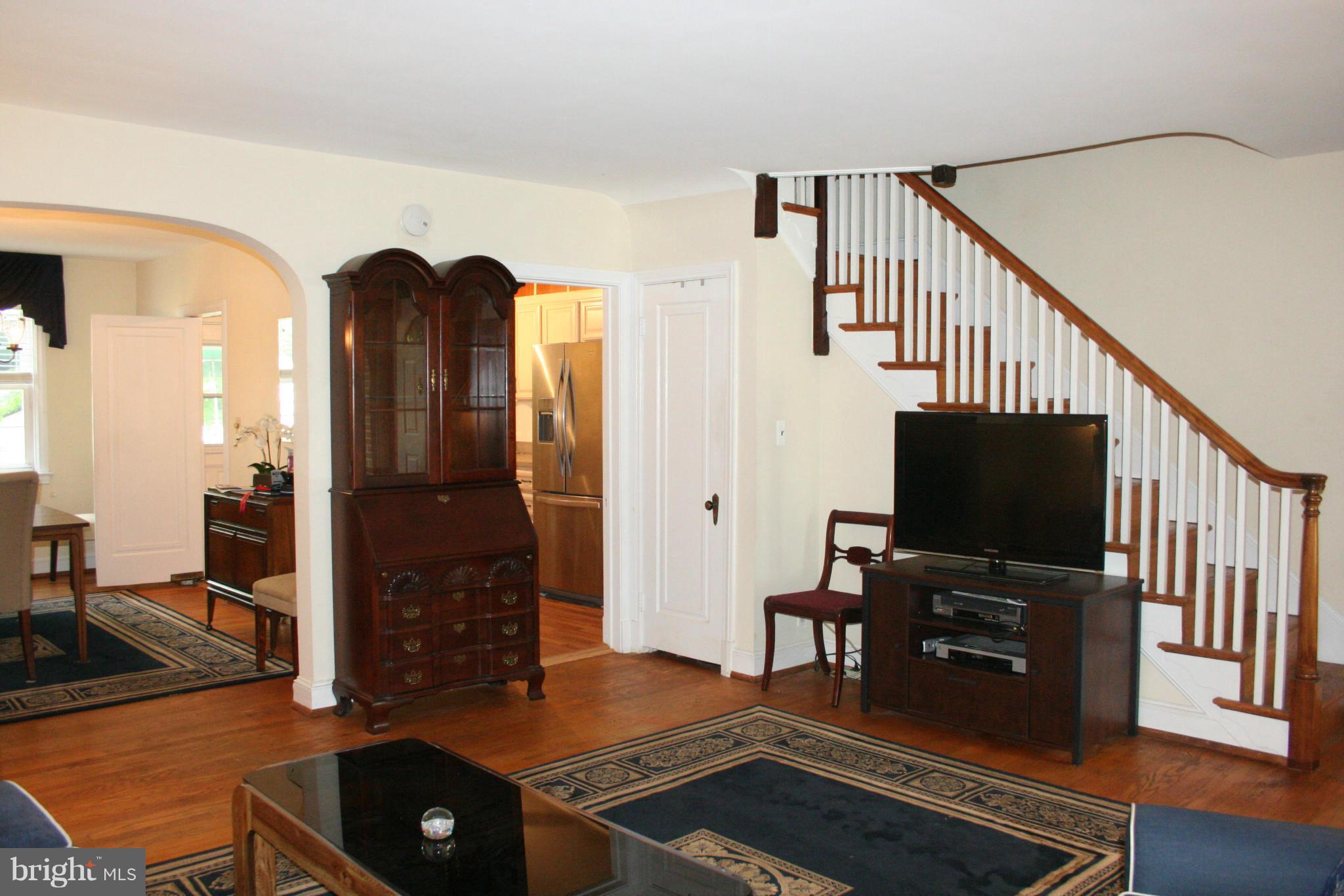216 Dunkirk Road Baltimore, MD 21212 - Photo 3 of 21 a living room with furniture and a flat screen tv