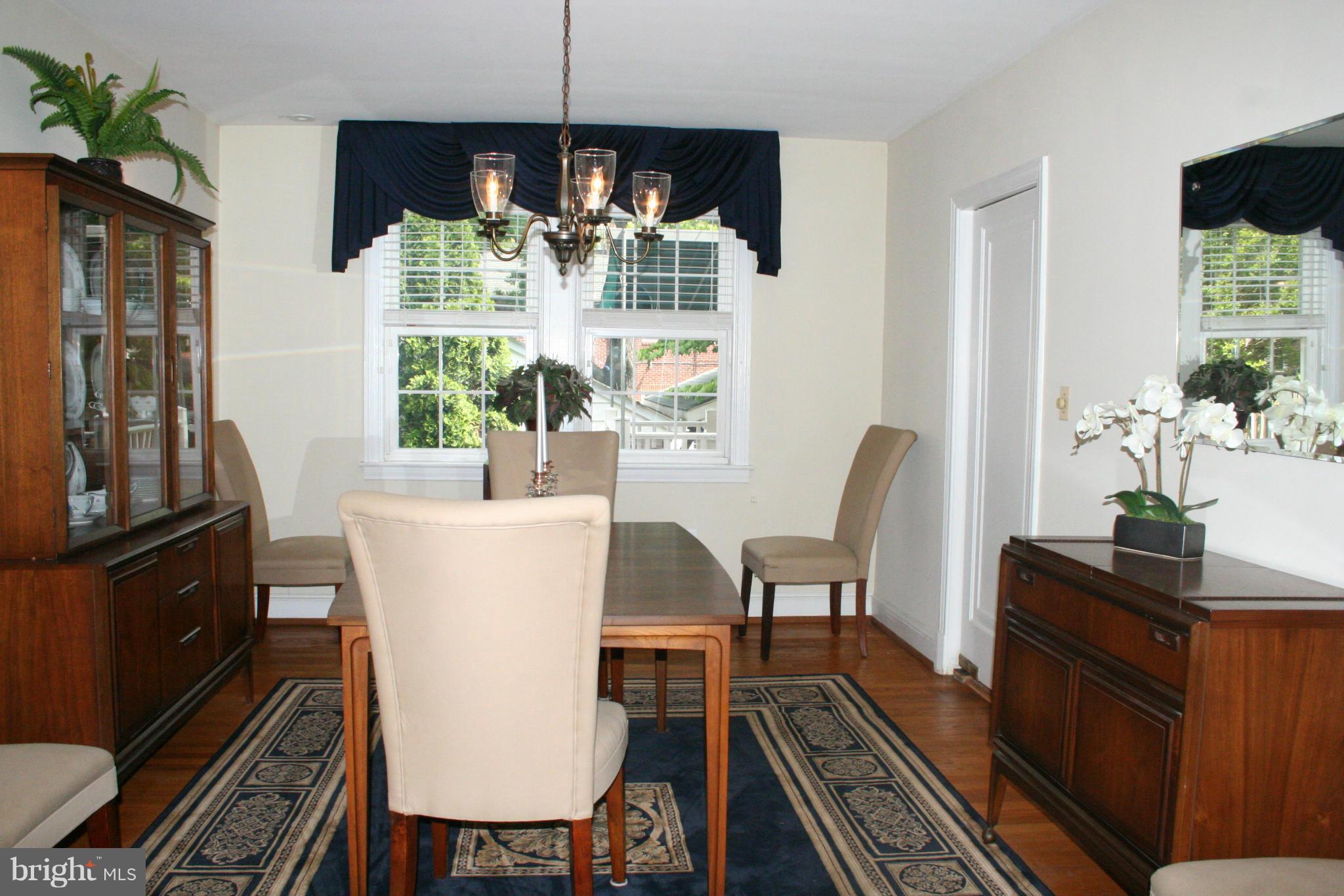 216 Dunkirk Road Baltimore, MD 21212 - Photo 4 of 21 a view of a dining room with furniture window and wooden floor