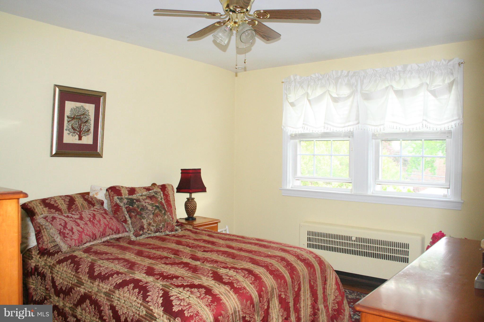 216 Dunkirk Road Baltimore, MD 21212 - Photo 8 of 21 a bedroom with a bed and window