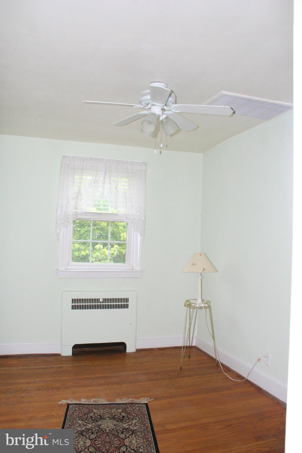 216 Dunkirk Road Baltimore, MD 21212 - Photo 9 of 21 a view of an empty room with a window
