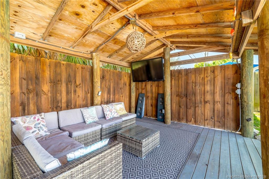 2859 Northeast Hickory Ridge Avenue Jensen Beach, FL 34957 - Photo 11 of 32 a living room with furniture and wooden floor