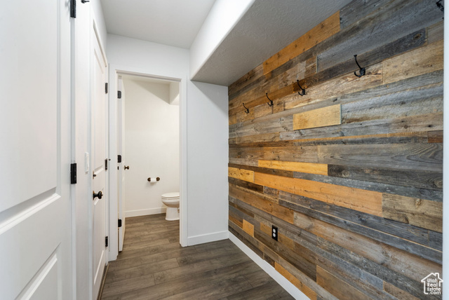 3456 South Linden Way Syracuse, UT 84075 - Photo 15 of 50 Corridor with wooden walls, dark wood-style flooring, and baseboards