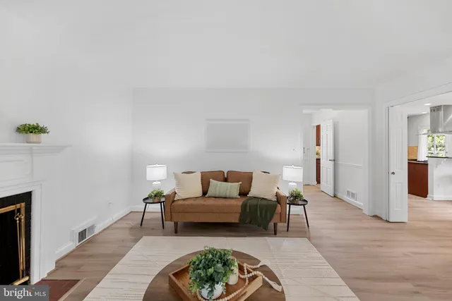 a living room with furniture and a rug