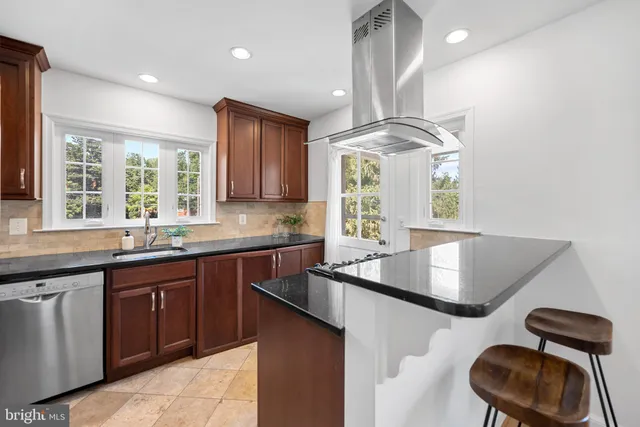 a kitchen with furniture and window