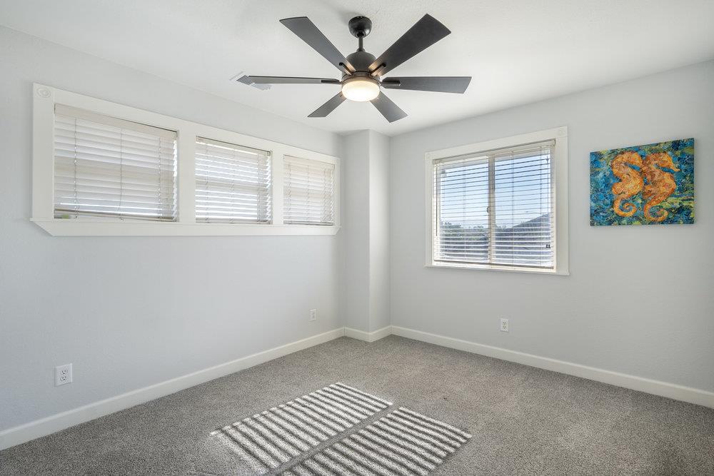 1120 Violet Way Gilroy, CA 95020 - Photo 26 of 39 a view of an empty room with window and a ceiling fan