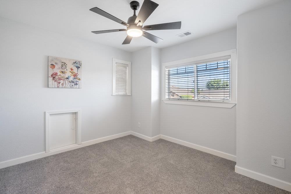 1120 Violet Way Gilroy, CA 95020 - Photo 30 of 39 an empty room with a window and a ceiling fan