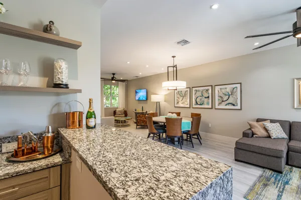 a bathroom with a double vanity sink toilet and shower