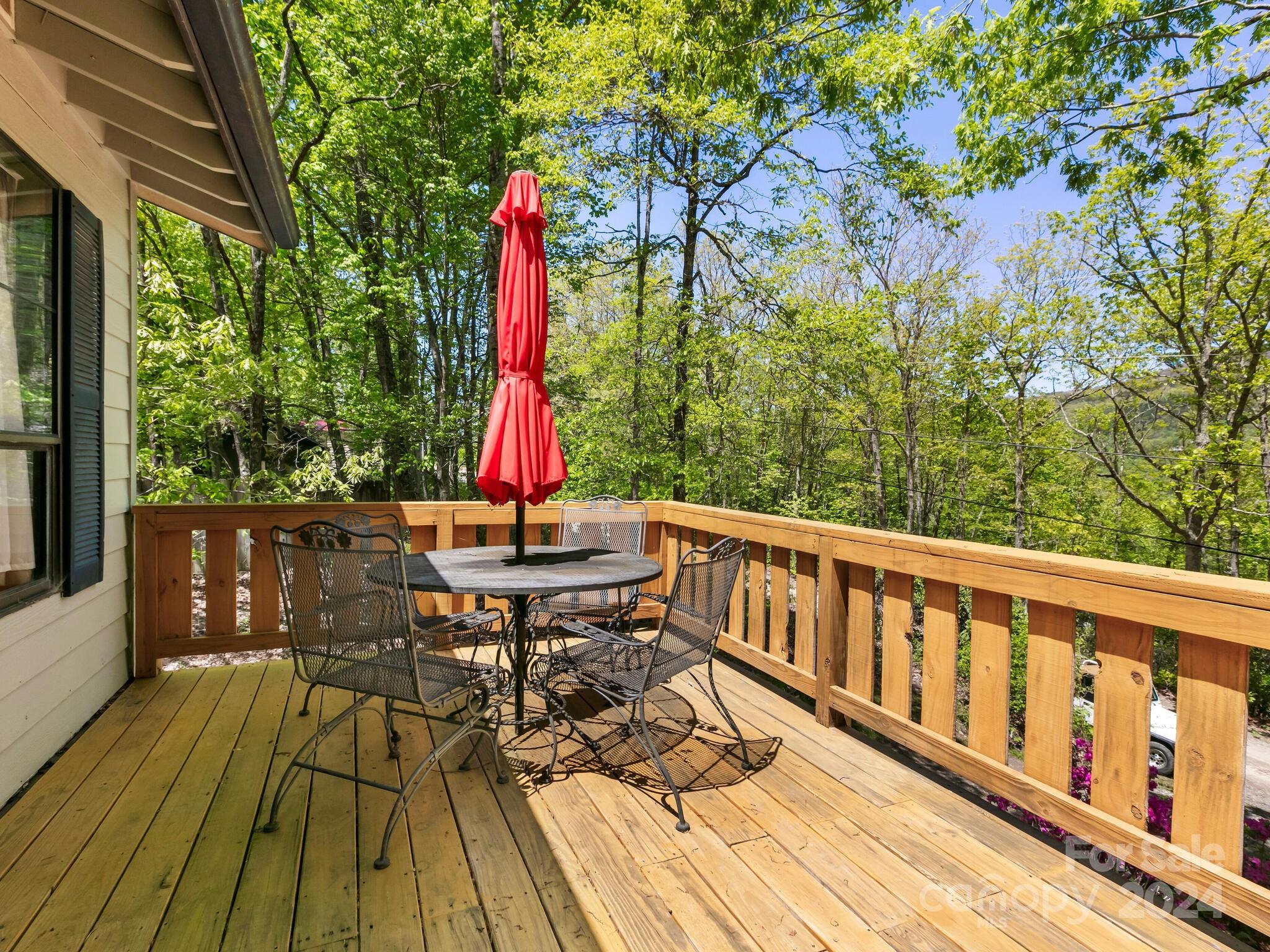 46 New Lite Road Fairview, NC 28730 - Photo 4 of 31 a view of balcony with wooden floor and outdoor seating