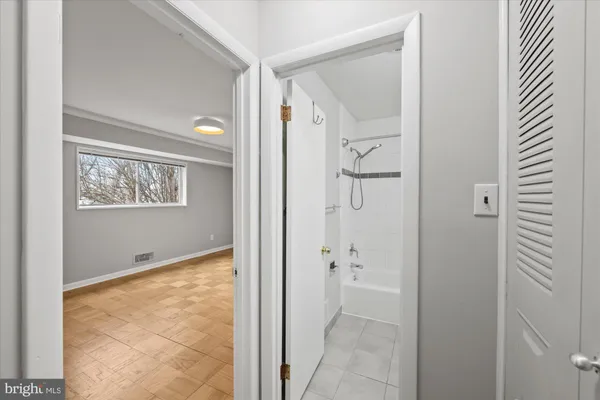 a view of a bathroom from a hallway