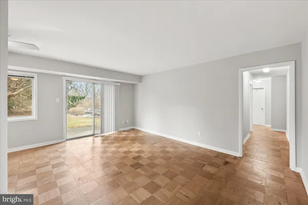 a view of an empty room with a window