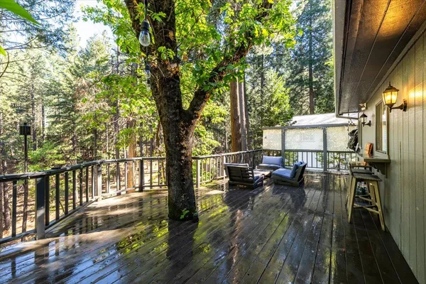 a view of balcony with couch and chairs