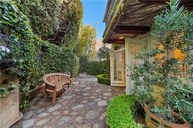 a view of a chair and table in the backyard
