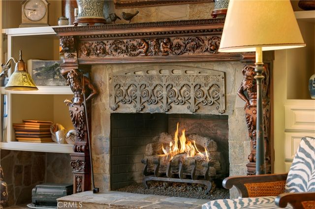 a large kitchen with a sink and chandelier