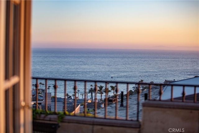 a view of a brick building next to a yard