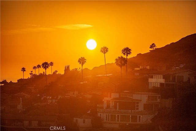 a kitchen with granite countertop white cabinets and stainless steel appliances