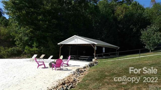 151 Pier Point Drive, Unit 9 Stony Point, NC 28678 - Photo 14 of 18 a view of swimming pool with a bench in front of the house