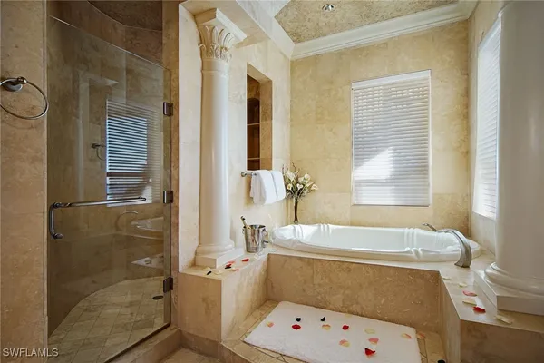 a large bathroom with a granite countertop double vanity sink and a mirror