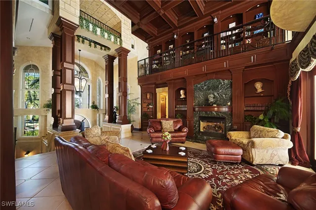 a kitchen with stainless steel appliances granite countertop a sink a counter space and a refrigerator