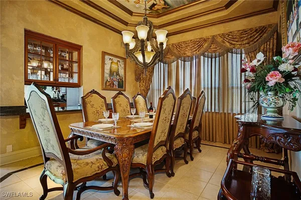 a living room with furniture a window and a flat screen tv