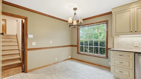 a living room with furniture a wooden floor and a flat screen tv