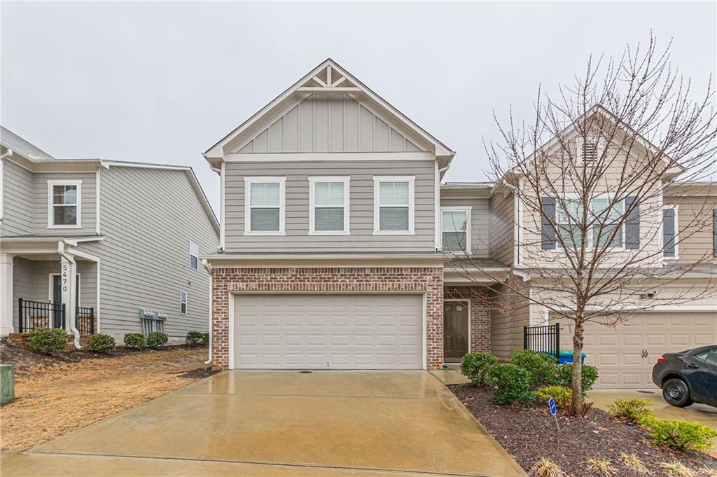 5474 Cascade Ridge Southwest Atlanta, GA 30336 - Photo 1 of 1 a front view of a house with a yard and garage