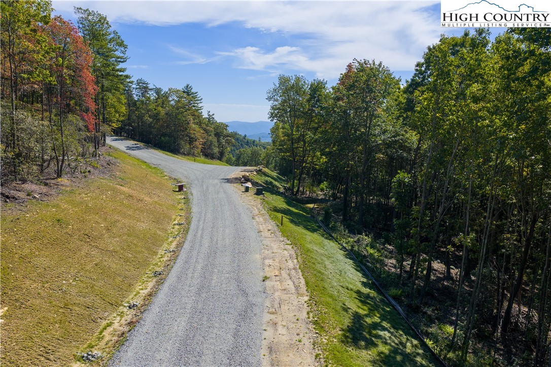 Lot 137 Angelfire Trail Deep Gap, NC 28618 - Photo 21 of 27 a view of a lake with a building in the background