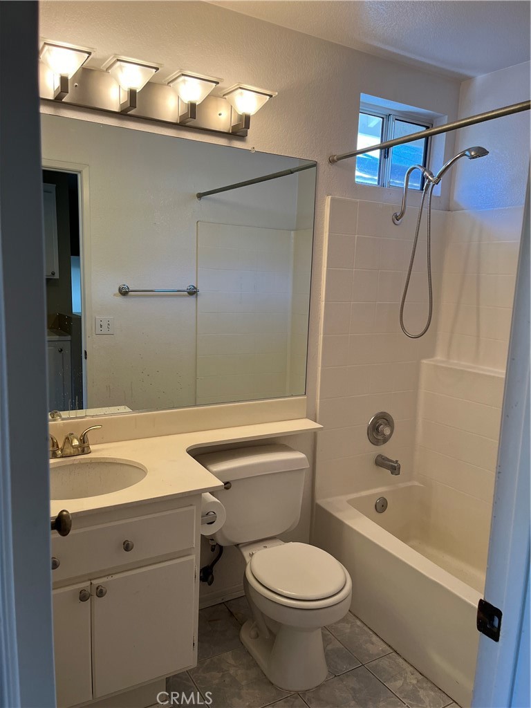 33033 Tulley Ranch Road Temecula, CA 92592 - Photo 11 of 14 a bathroom with a sink a toilet and shower