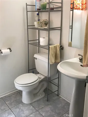 a bathroom with a toilet and a sink
