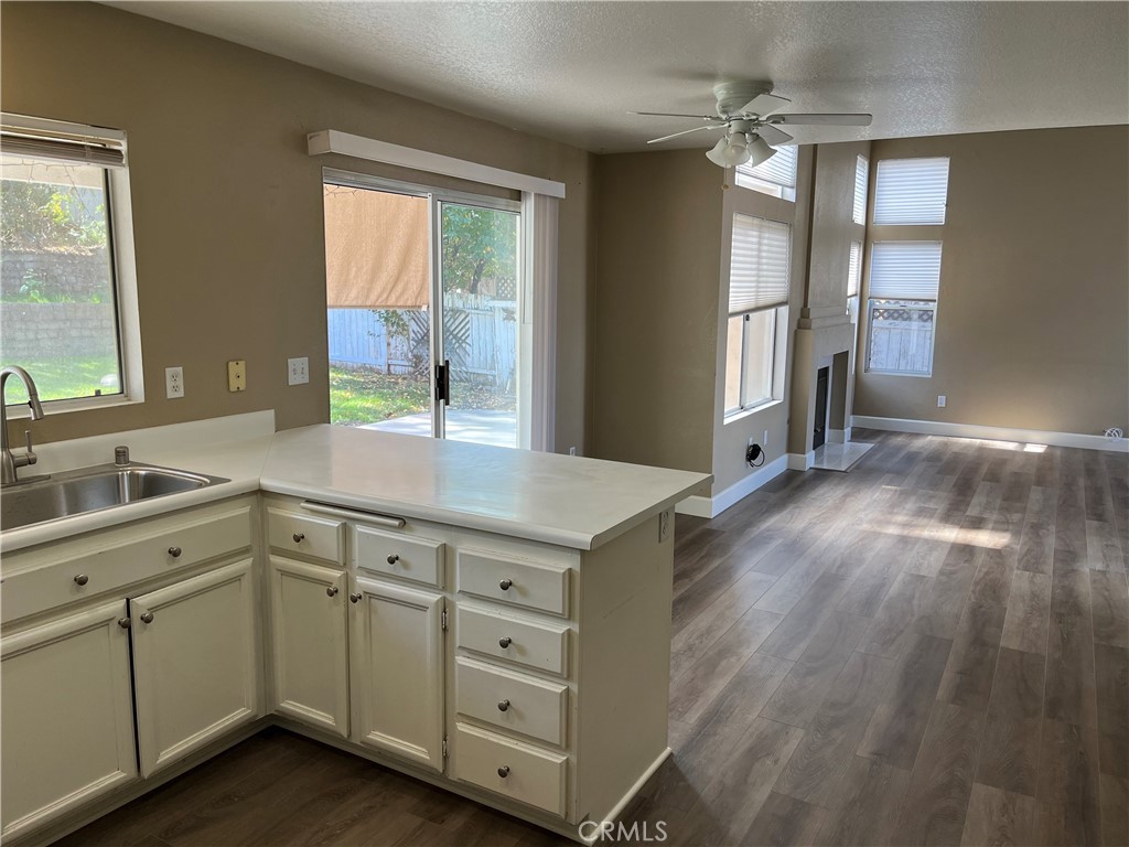 33033 Tulley Ranch Road Temecula, CA 92592 - Photo 4 of 14 a kitchen with cabinets a sink and appliances