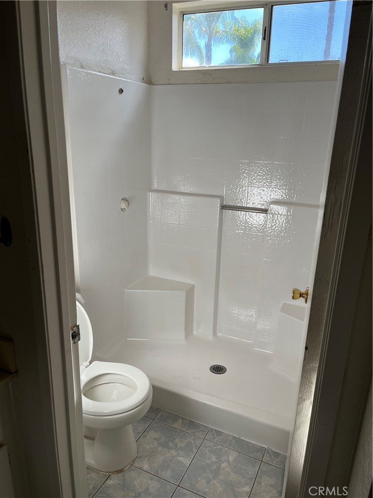 33033 Tulley Ranch Road Temecula, CA 92592 - Photo 9 of 14 a bathroom with a toilet and a shower