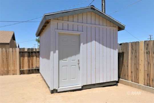 1420 South Yorktown Street Ridgecrest, CA 93555 - Photo 26 of 27 a view of a house with wooden fence