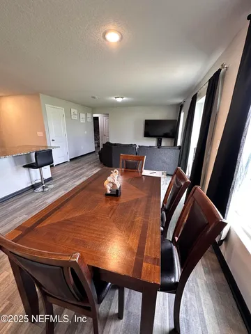 a view of a dining room with furniture