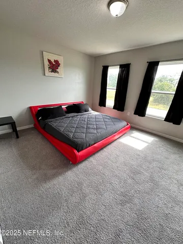 a room with pool and windows