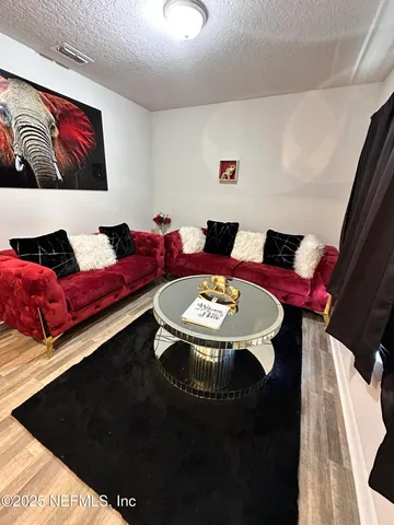 a living room with furniture and rug