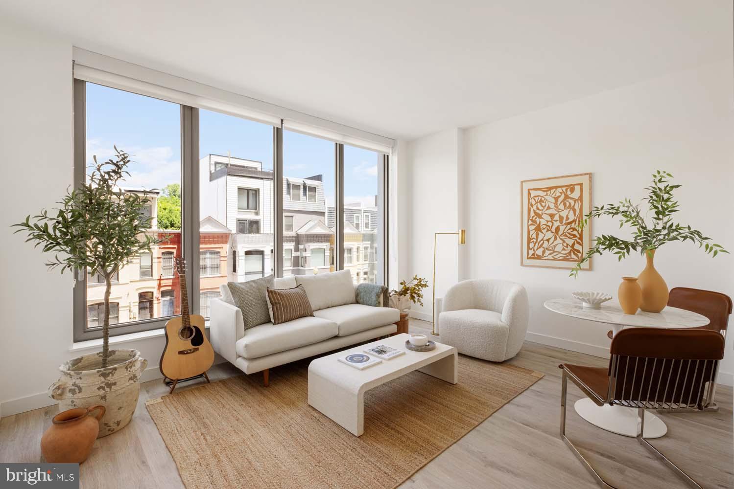 1 Florida Avenue Northeast, Unit 501 Washington, DC 20002 - Photo 2 of 14 a living room with furniture and a large window